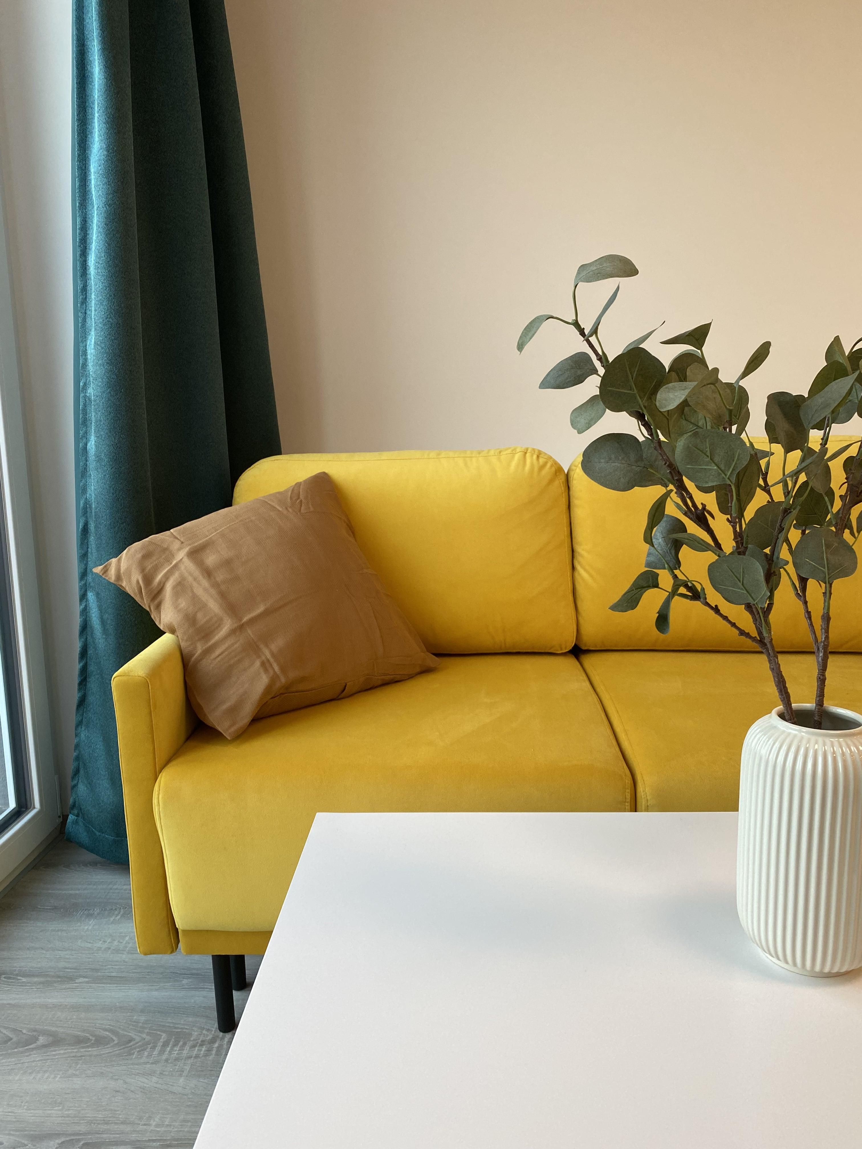 Yellow couch with decorations