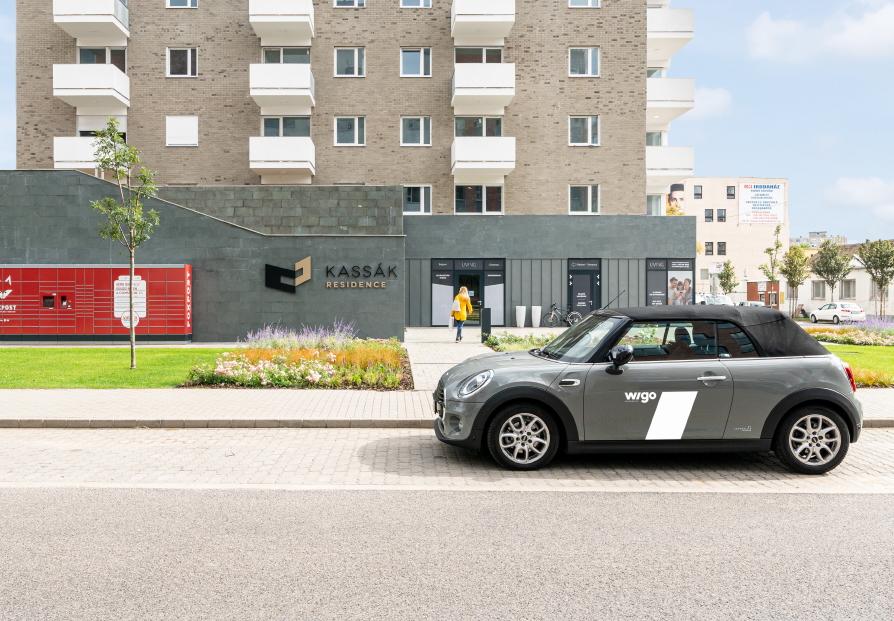 Wigo car parking in front of a building